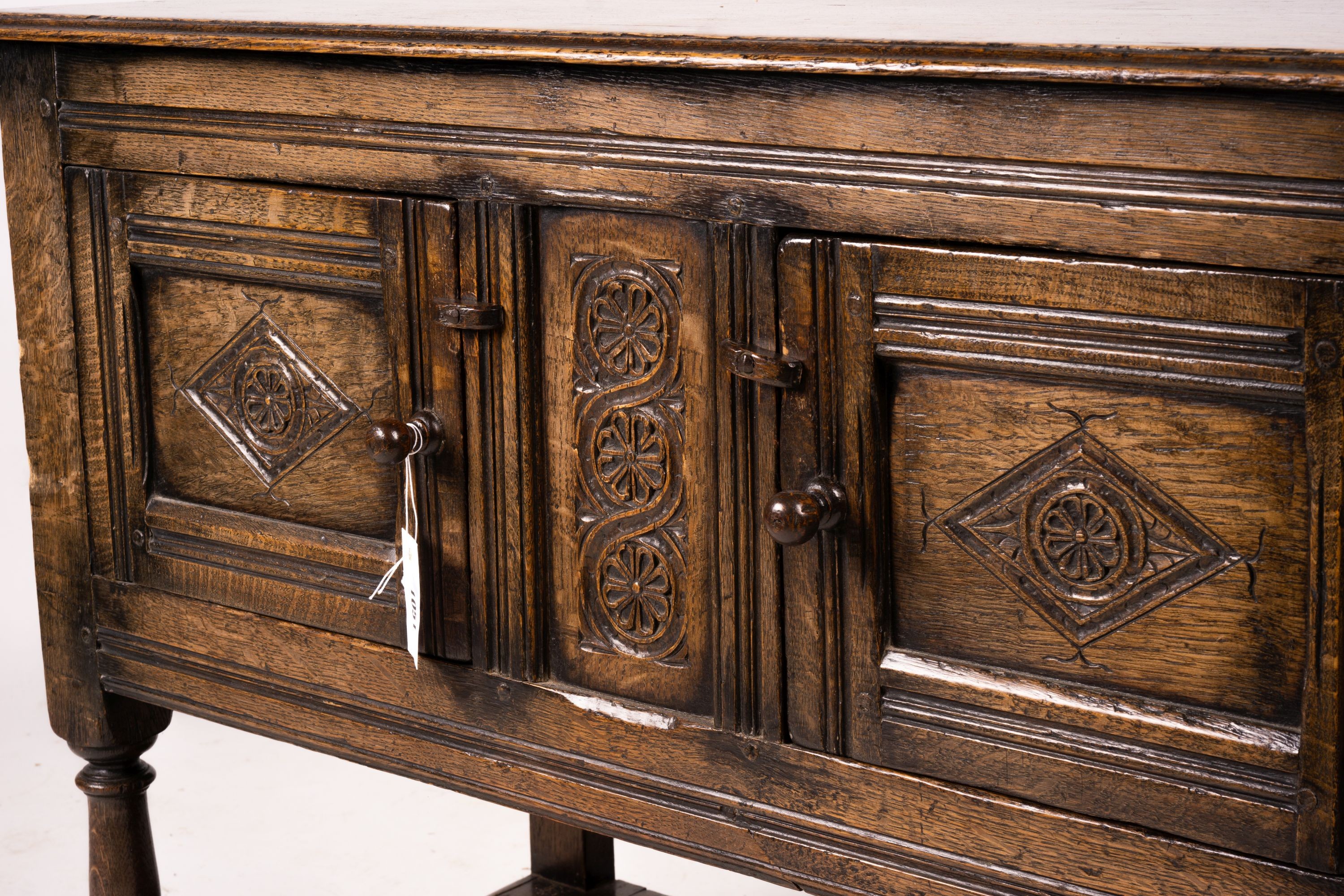 An 18th century style oak two door low cupboard, width 106cm, depth 50cm, height 78cm